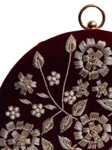 Maroon Shalimar hand-embroidered clutch by The Tan Clan with intricate embroidery and elegant design visible in the image.
