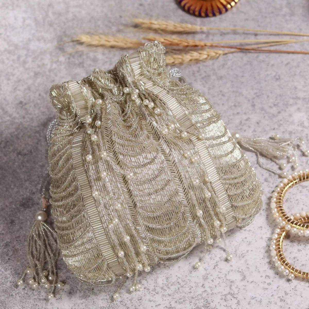 Sharda Potli Bag with Handle by The Tan Clan featuring intricate embroidery and traditional design, perfect for festive occasions.