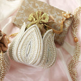 Embroidered mini lotus potli bag with intricate hand embroidery from The Tan Clan, featuring traditional festive design.