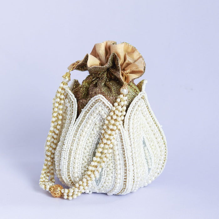 Hand-embroidered mini lotus potli bag by The Tan Clan with intricate embroidery and a drawstring closure.