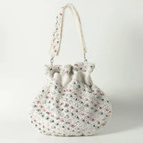 Shubhra Potli Bag with Handle by The Tan Clan, stylish traditional accessory with intricate design and fabric handle.