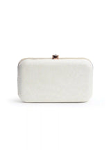 White pearl hand-embroidered clutch bag by The Tan Clan with intricate detailing and elegant design.