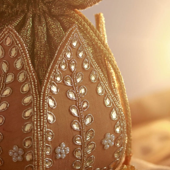 Sindh Kundan handwork mini lotus potli bag with intricate embroidery and traditional design, crafted by The Tan Clan.