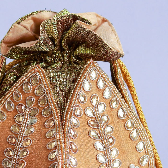 Sindh Kundan handwork mini lotus potli bag by The Tan Clan with intricate Kundan detailing and floral design.