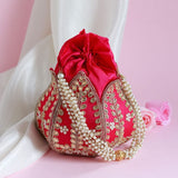 Sindh Kundan Handwork Mini Lotus Potli by The Tan Clan with intricate Kundan detailing and floral lotus design.
