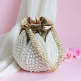 Peach mini lotus potli bag with pearl embroidery and drawstring closure, traditional Indian accessory by The Tan Clan.