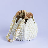 Pearl embroidered mini lotus potli bag with intricate design by The Tan Clan, perfect for traditional occasions and accessories.