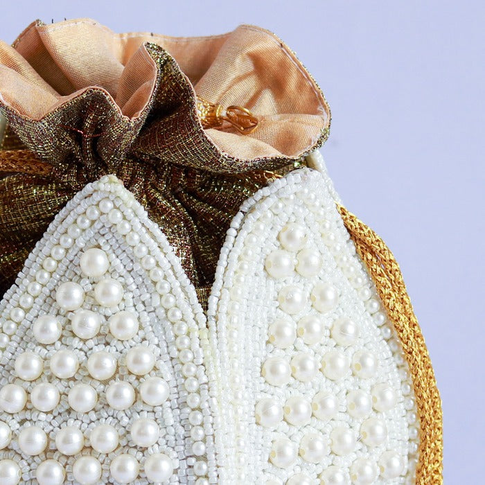 Pearl embroidered mini lotus-shaped potli bag with intricate embroidery, crafted by The Tan Clan for traditional elegance.