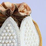 Pearl embroidered mini lotus-shaped potli bag with intricate embroidery, crafted by The Tan Clan for traditional elegance.