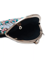 Sona Pearl Tasselled Batua bag with a detachable handle by The Tan Clan, featuring pearl embellishments and tassel details.