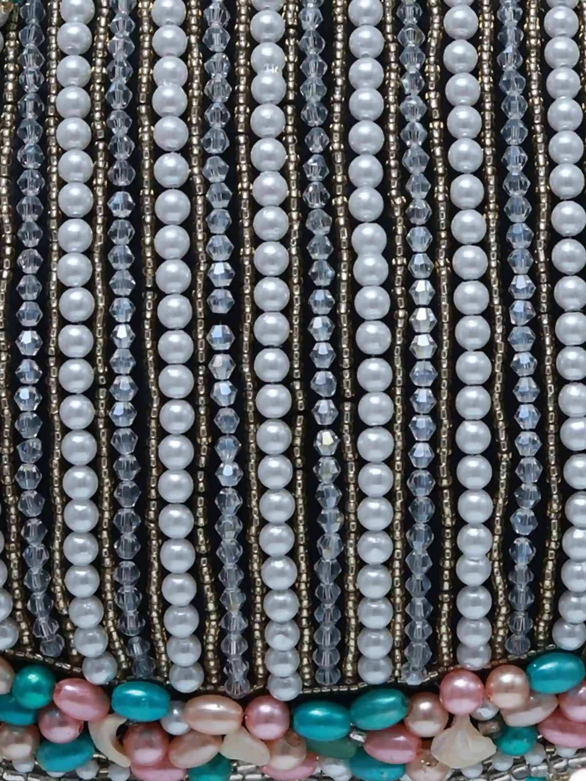 Pearl tasselled Batua with detachable handle by The Tan Clan, featuring intricate design and elegant craftsmanship.