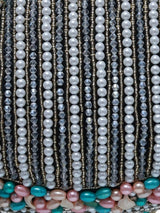 Pearl tasselled Batua with detachable handle by The Tan Clan, featuring intricate design and elegant craftsmanship.
