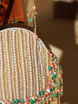 Pearl tasselled Batua bag with detachable handle by The Tan Clan, featuring intricate designs and traditional craftsmanship.