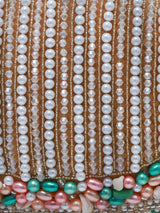 Sona Pearl Tasselled Batua bag by The Tan Clan with detachable handle and intricate pearl tassel detailing.