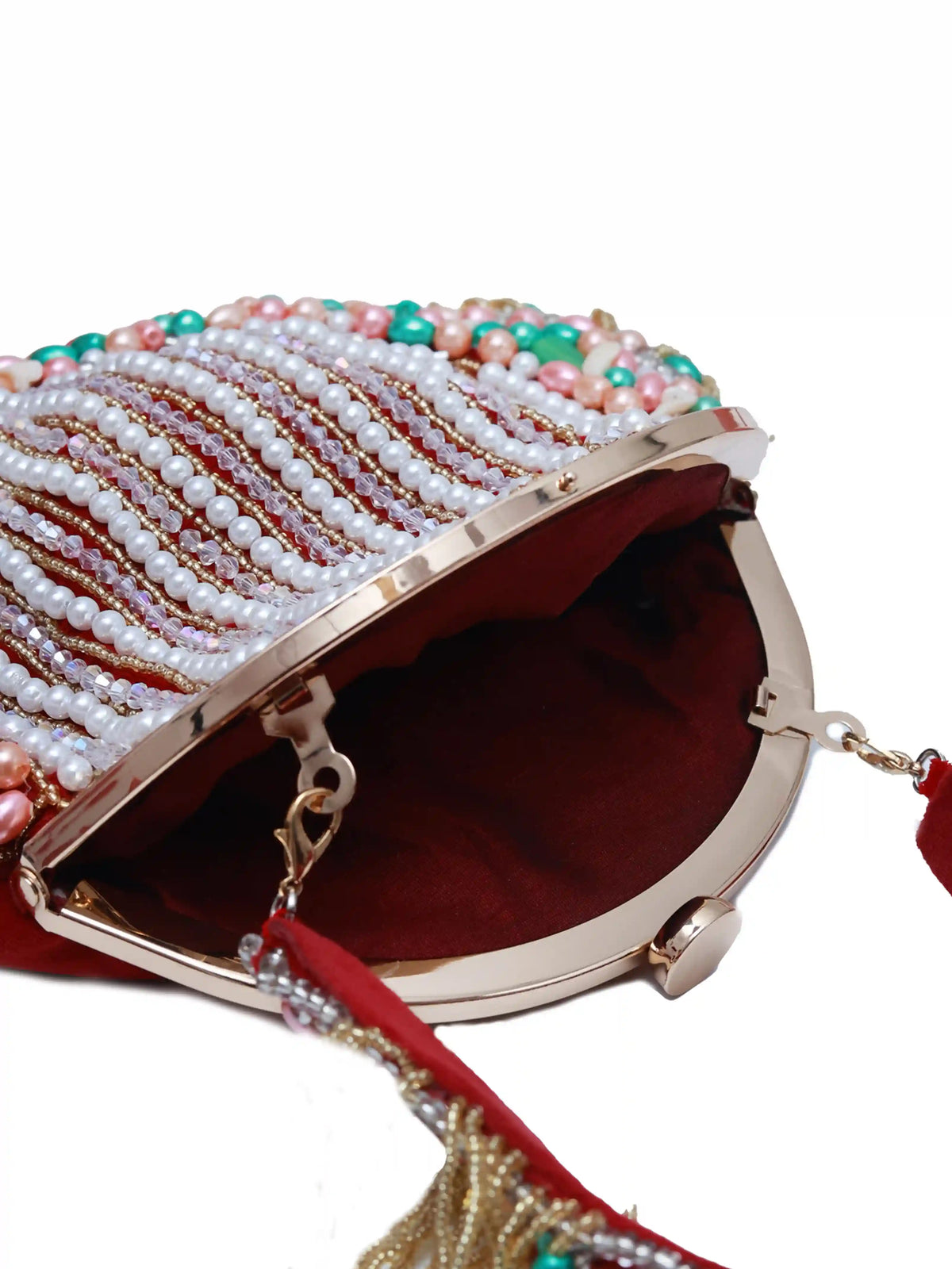Sona Pearl Tasselled Batua bag with detachable handle from The Tan Clan, featuring pearl embellishments and tassel details.