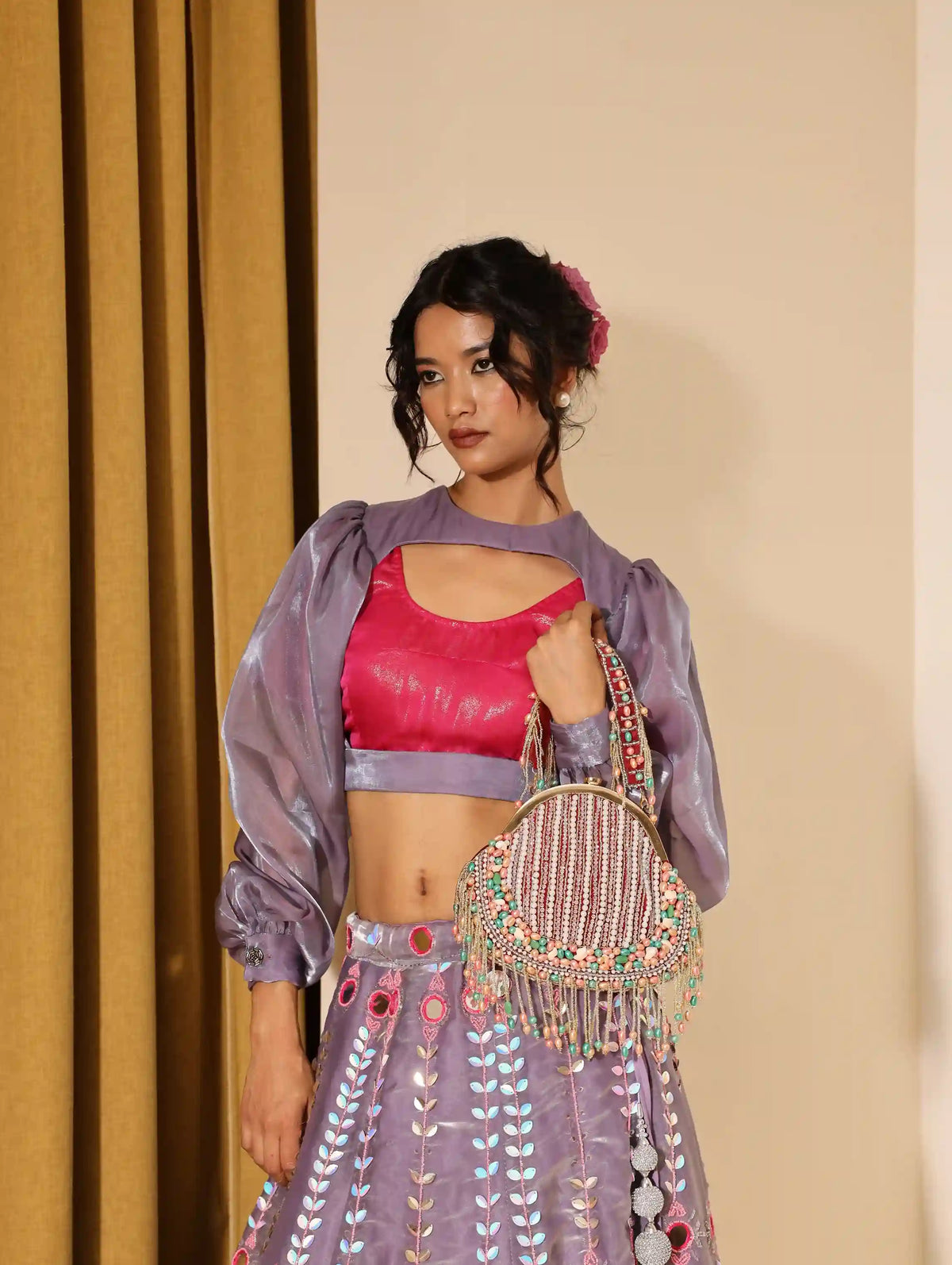 Sona Pearl Tasselled Batua from The Tan Clan featuring pearl embellishments and a detachable handle for versatile use.