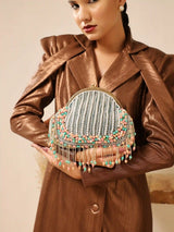 Pearl tasselled Batua handbag with detachable handle by The Tan Clan, featuring intricate design and elegant craftsmanship.