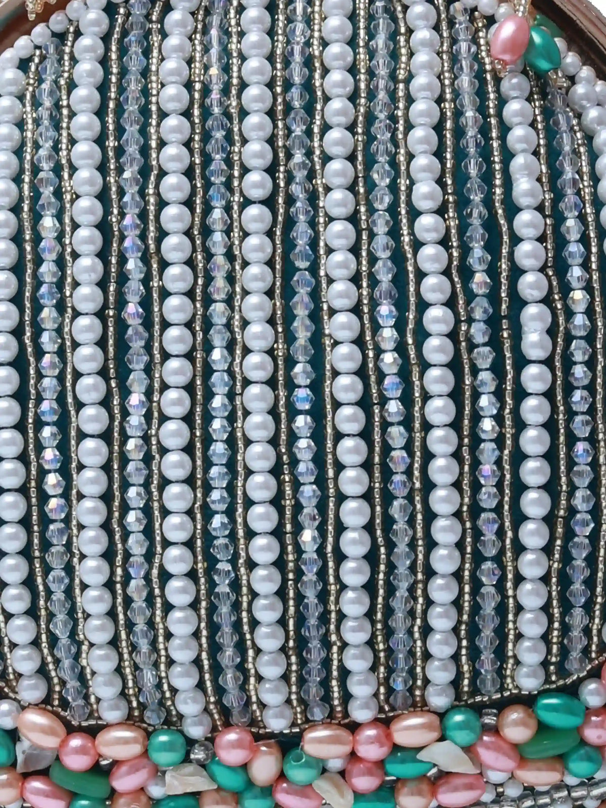 Pearl tasselled Batua bag with detachable handle by The Tan Clan, featuring intricate detailing and elegant design.