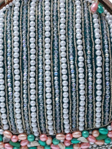 Pearl tasselled Batua bag with detachable handle by The Tan Clan, featuring intricate detailing and elegant design.