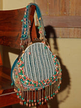 Pearl tasselled Batua bag with detachable handle from The Tan Clan, featuring intricate detailing and a traditional design.