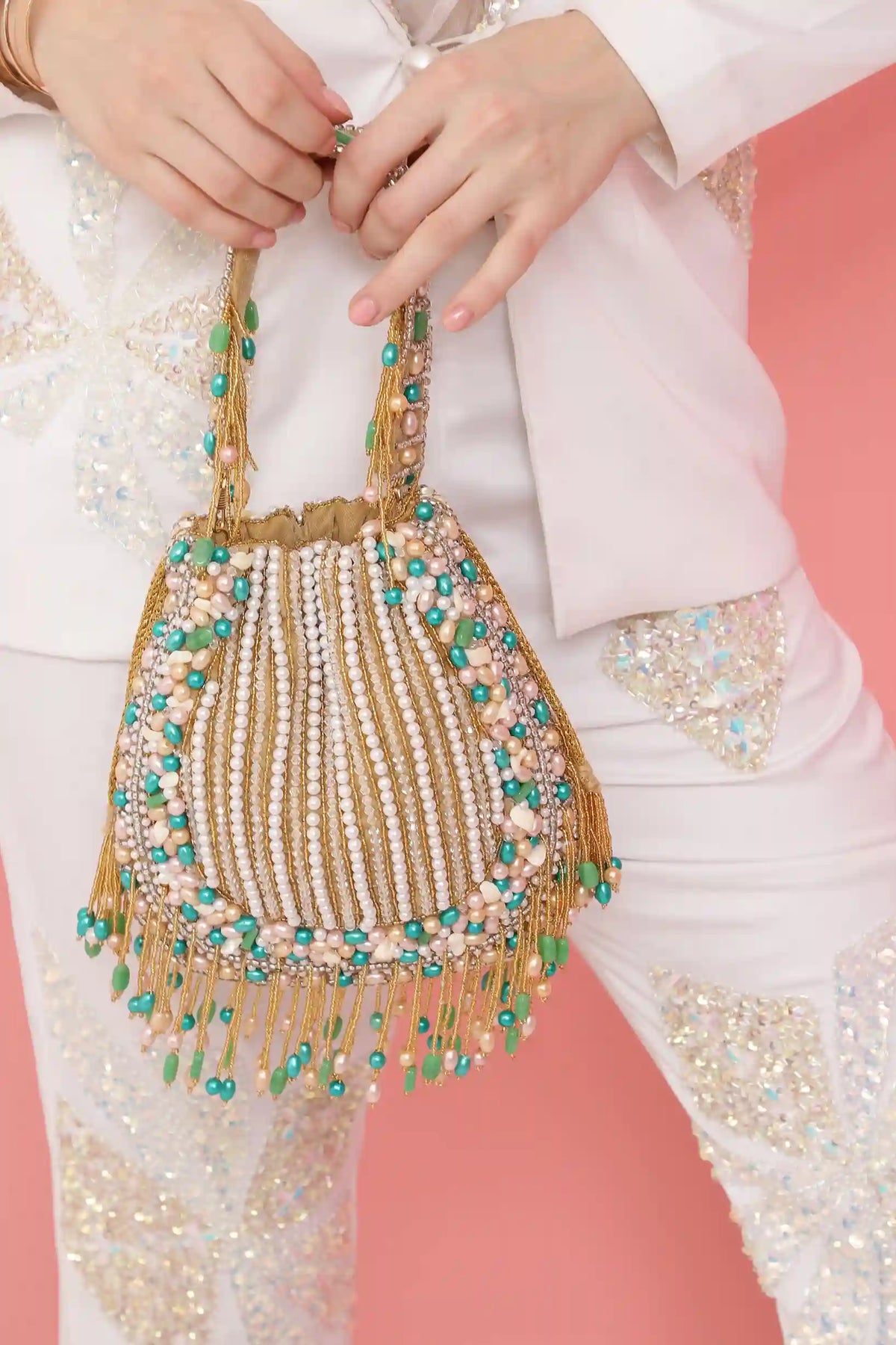 Sona Potli Bag with Handle by The Tan Clan, featuring traditional design and decorative details, suitable for festive occasions.