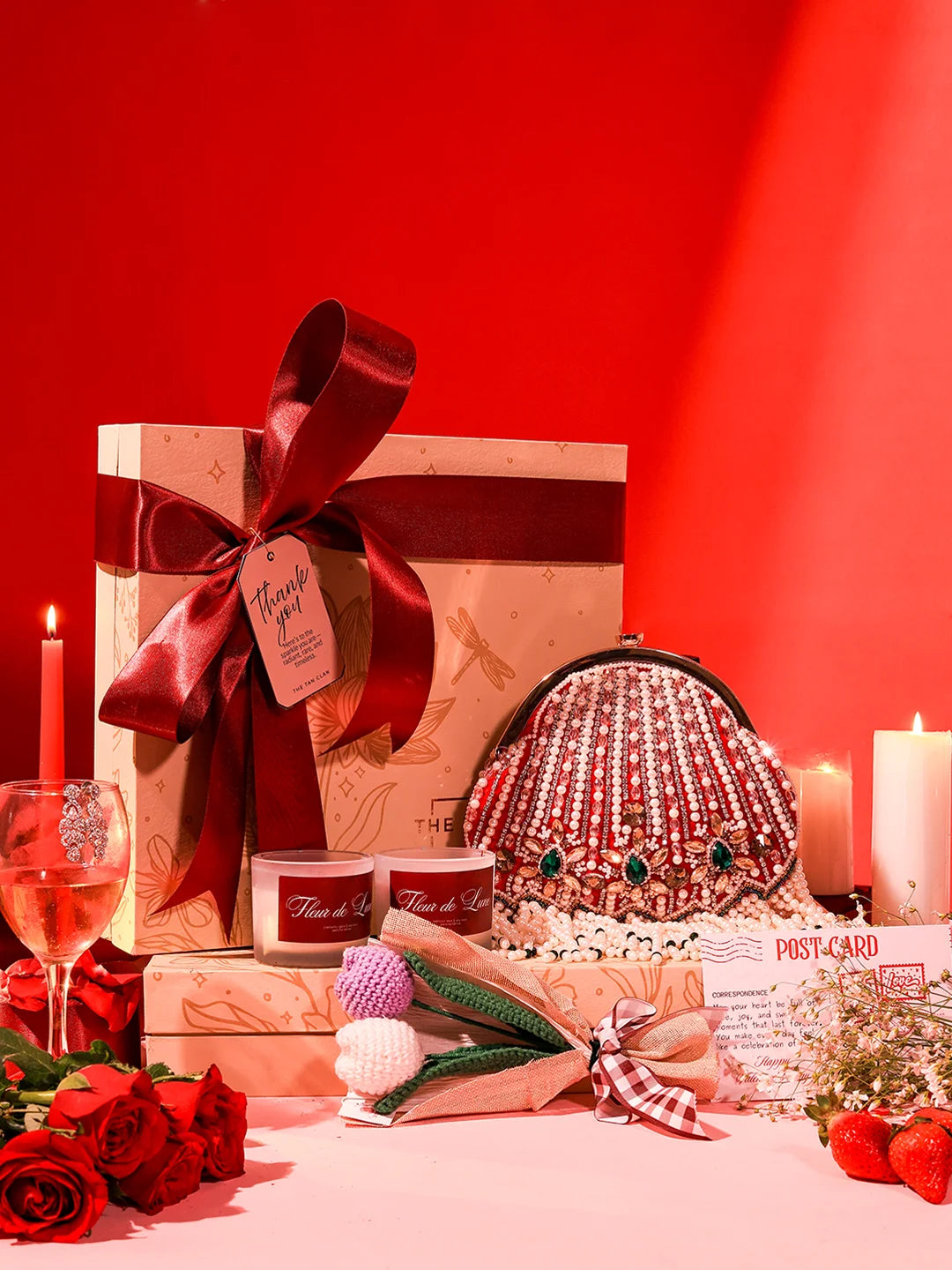 Soul-Care Gift Set featuring a Frida clutch, candle, and flower arrangement, all from THE TAN CLAN.