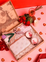 Soul-Care gift set featuring a Taj clutch, candle, and flower, with elegant accessories from THE TAN CLAN.