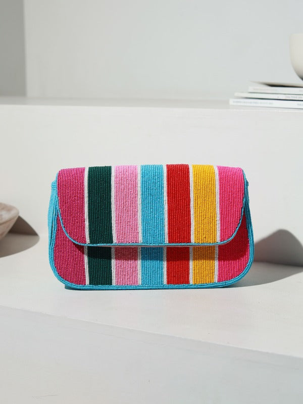 Stripe multicolor baguette bag with handle by The Tan Clan, featuring a vibrant striped design and compact, stylish shape.