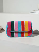 Stripe multicolor baguette bag with handle by The Tan Clan, featuring a vibrant striped design and compact, stylish shape.