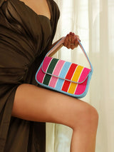 Stripe multicolor baguette bag with handle from The Tan Clan, featuring vibrant striped design and compact, stylish shape.