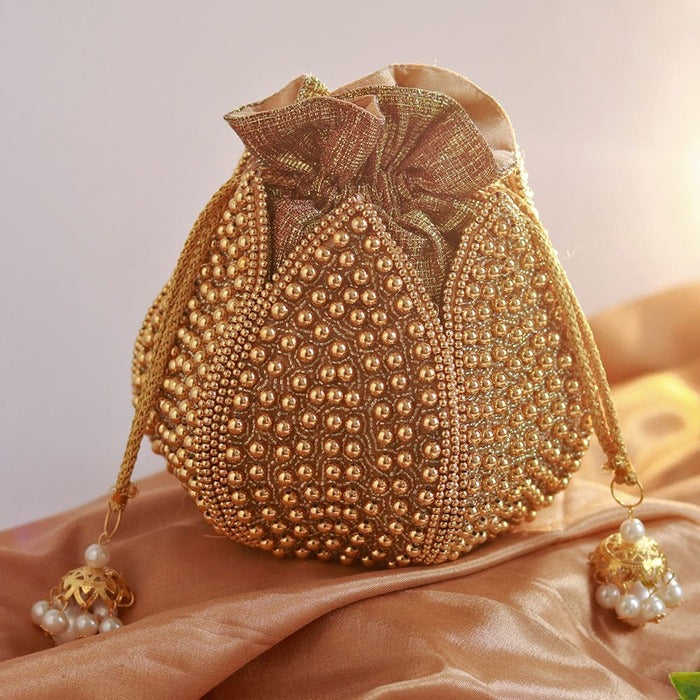 Suryaa Moti embroidered mini lotus potli bag with intricate beadwork, traditional Indian accessory by The Tan Clan.