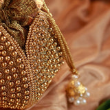 Embroidered mini lotus potli bag with intricate Motif design by The Tan Clan, featuring traditional embroidery and a compact shape.
