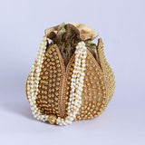Embroidered mini lotus potli bag with intricate motifs from The Tan Clan, featuring traditional Indian embroidery and a drawstring closure.