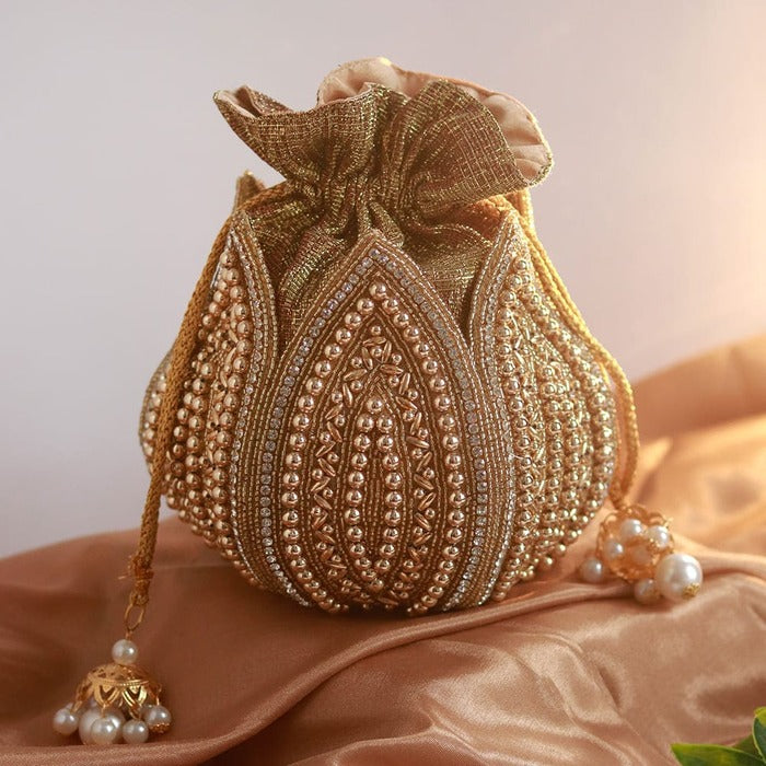 Hand-embroidered mini lotus potli bag by The Tan Clan with intricate embroidery and traditional design.