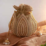 Hand-embroidered mini lotus potli bag by The Tan Clan with intricate embroidery and traditional design.