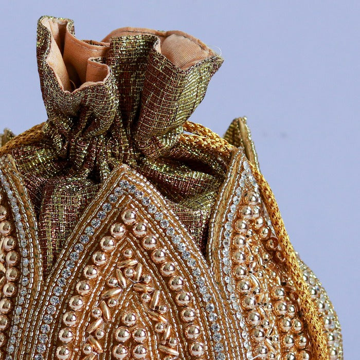 Swarn hand-embroidered mini lotus potli bag from The Tan Clan with intricate embroidery and traditional design.