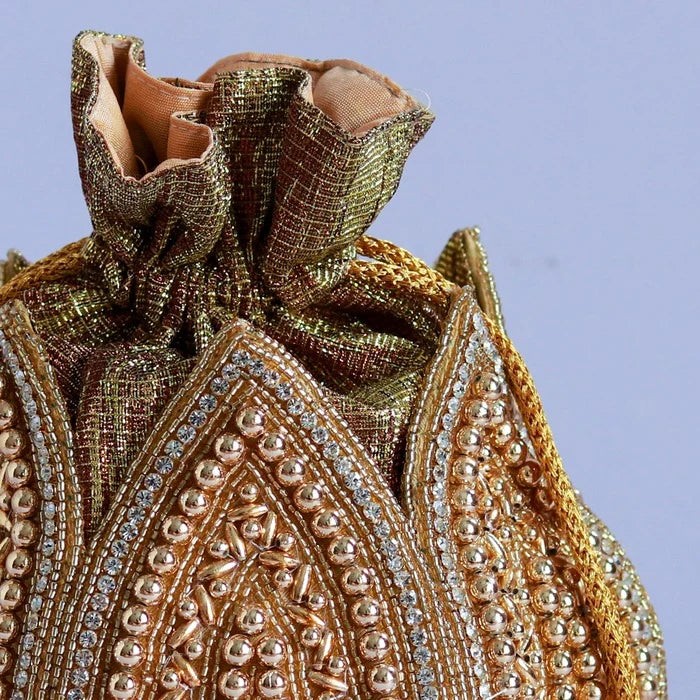 Hand embroidered mini lotus potli bag from The Tan Clan featuring intricate embroidery and traditional design.