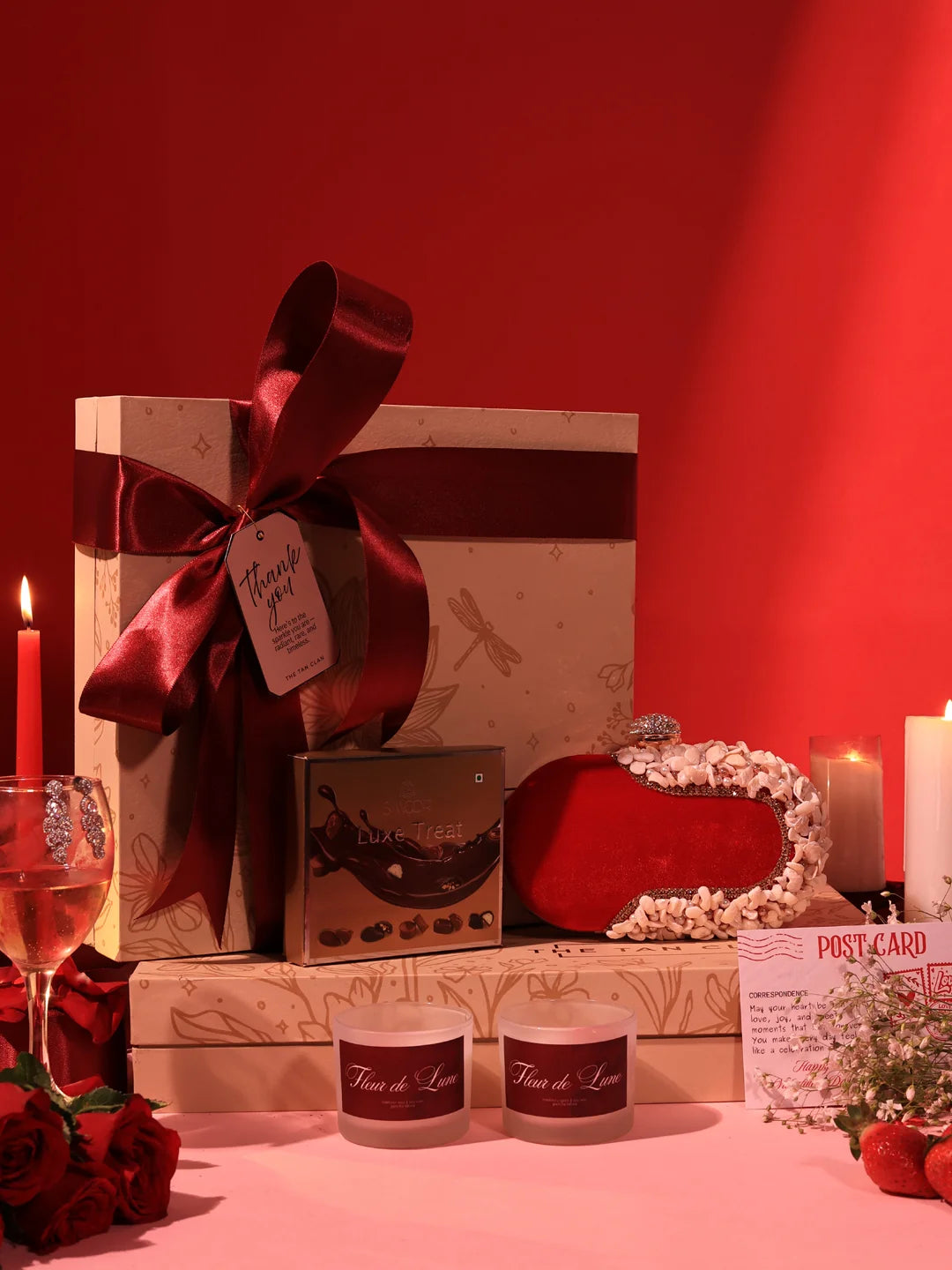 Sweet Candle Gift Set by THE TAN CLAN featuring a Dariya clutch, candle, and chocolates in a set of three.
