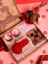 Set of three Sweet-Candle Gift Set by THE TAN CLAN featuring Dariya clutch, candles, and chocolates arranged together.