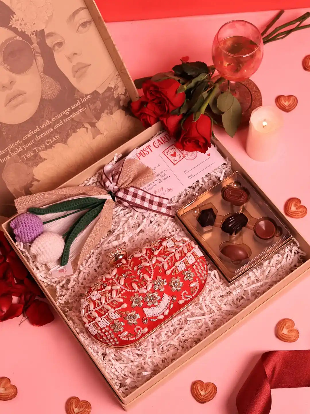 Set of three THE TAN CLAN Sweet-Flower gift sets featuring Elizah clutch bags with flowers and chocolates, perfect for gifting.