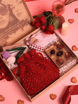 Sweet flower gift set by THE TAN CLAN featuring Rosa potli with flowers and chocolates in a set of three.