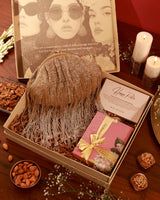 Sweet Treat Hamper from The Tan Clan featuring an assortment of chocolates, candies, and confections in a stylish gift box.