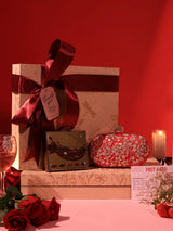 Set of 2 Baiza Clutch sweet treat hampers with chocolates from THE TAN CLAN, featuring elegant clutch designs and assorted chocolates.