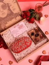 Set of 2 Baiza Clutch handbags from THE TAN CLAN with sweet treat hampers and chocolates, featuring elegant design and stylish accessories.