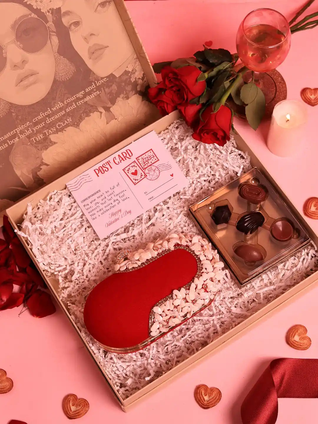 Set of two Sweet Treat Dariya Clutch hampers with chocolates from THE TAN CLAN, featuring elegant clutch designs and assorted chocolates.