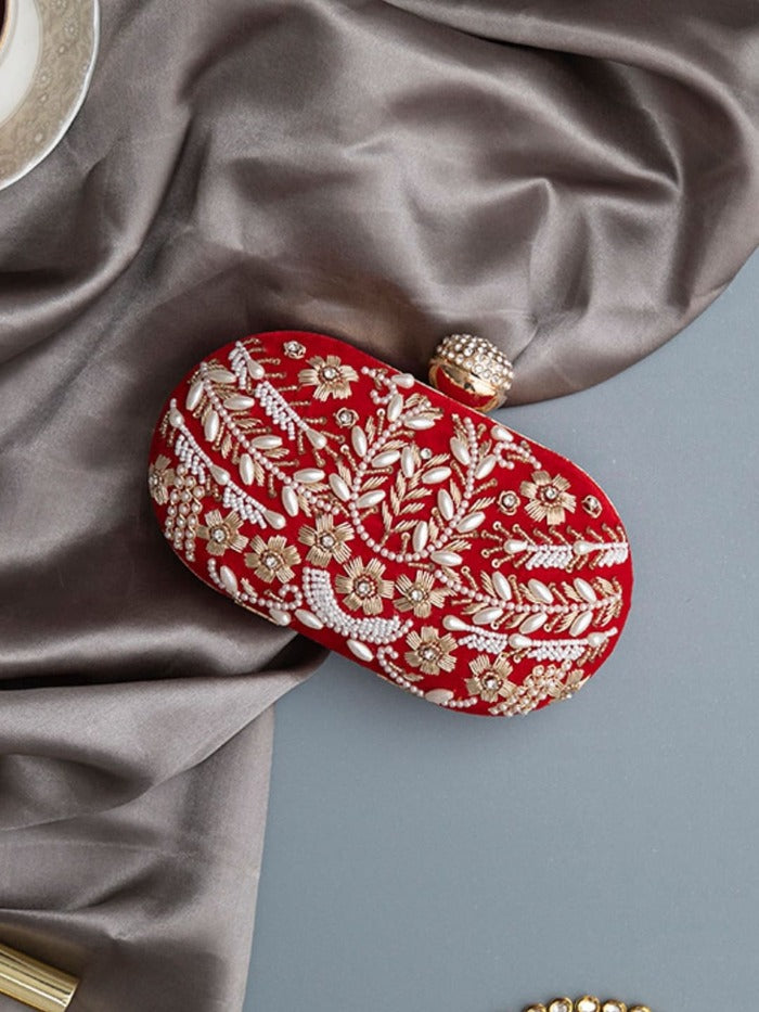 Set of two Elizah Clutch sweet treat hampers with chocolates from THE TAN CLAN, featuring elegant clutch designs and assorted chocolates.