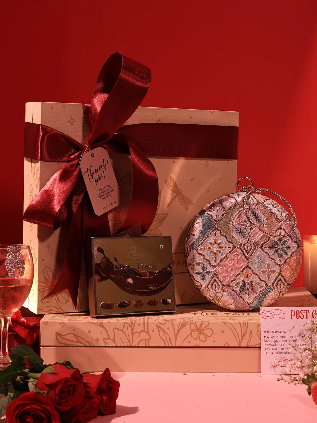 Set of two Sweet Treat Hamper mugs with Mughal clutch design and chocolates by THE TAN CLAN, featuring colorful patterns and textures.