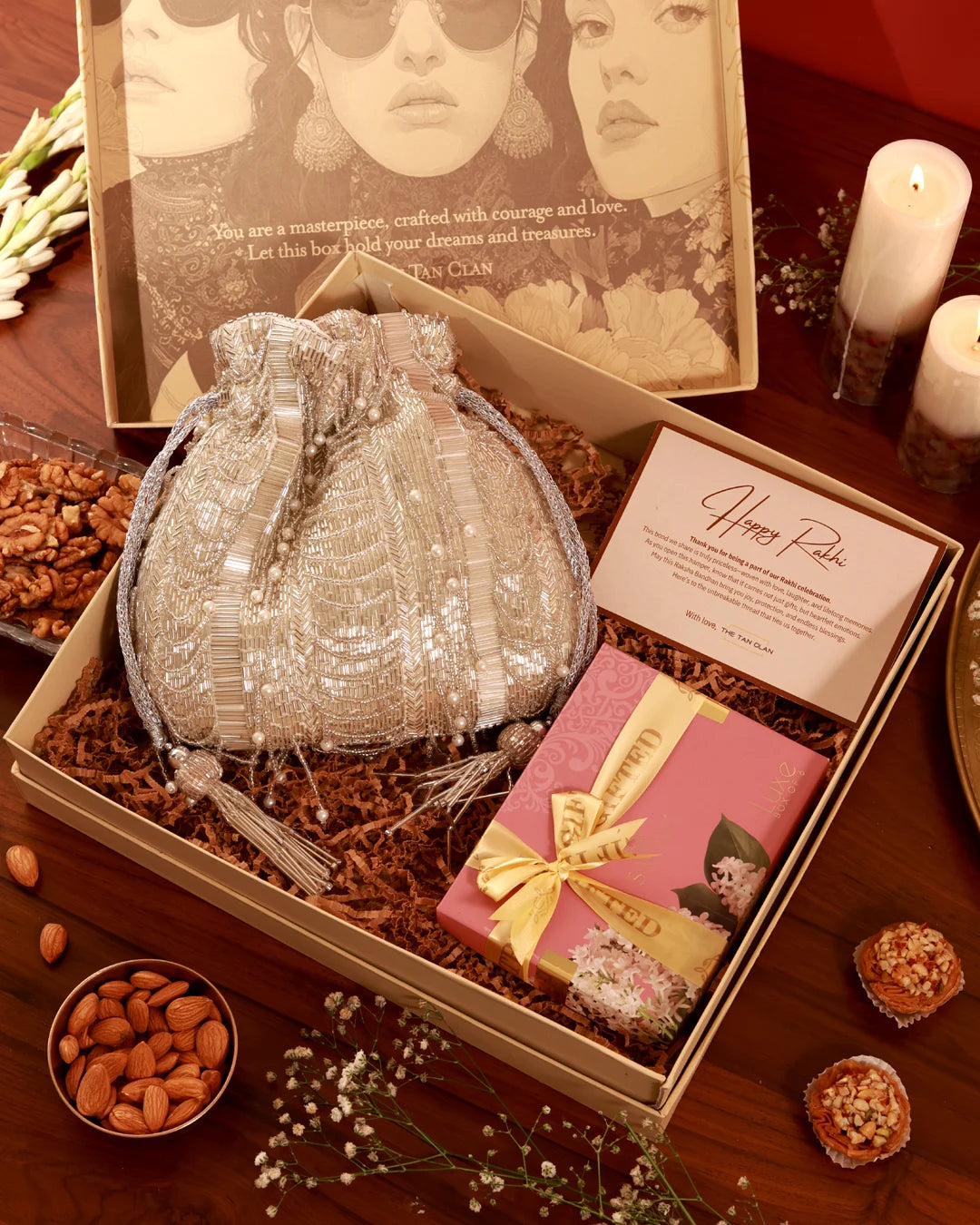 Assorted sweet treats in a gift hamper from The Tan Clan's Sweet Treat Hamper Sharda collection, featuring chocolates and confections.