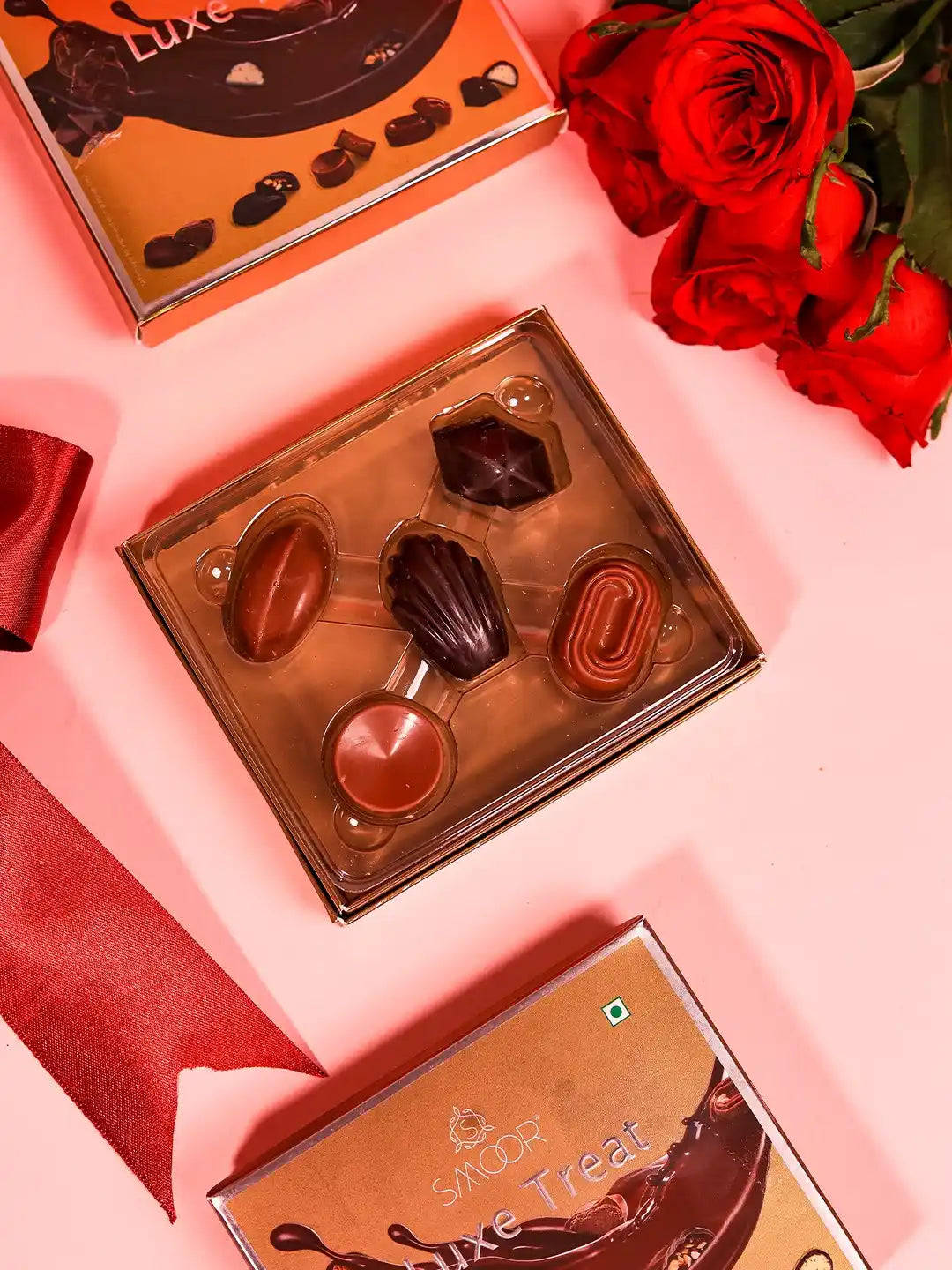 Set of two Sweet Treat Hamper Taj Clutch with chocolates from THE TAN CLAN, featuring elegant clutch boxes and assorted chocolates.
