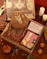 Sweet Treat Hamper Twinkle by The Tan Clan featuring assorted chocolates, candies, and confections in a festive gift box.